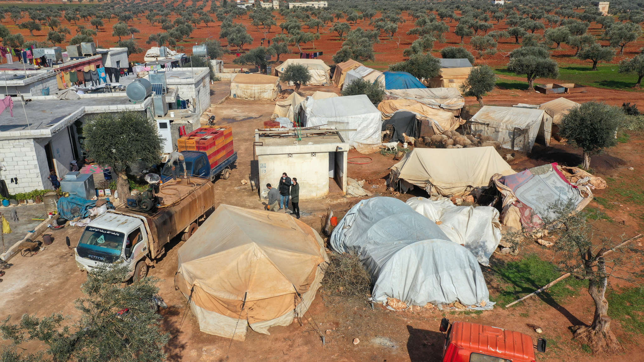 In northwest syria, mercy corps teams provide water and hygiene support to an encampment for people forced from their homes by violence.