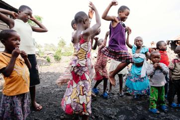  a group of young people playing a game together.