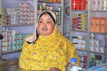 A  business owner tending to their shop.