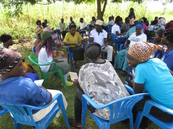 A group of people meeting in small groups.